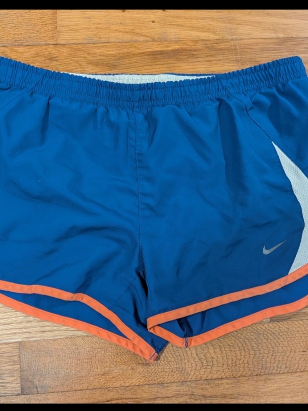Nike Women's Blue Athletic Shorts with Orange Trim